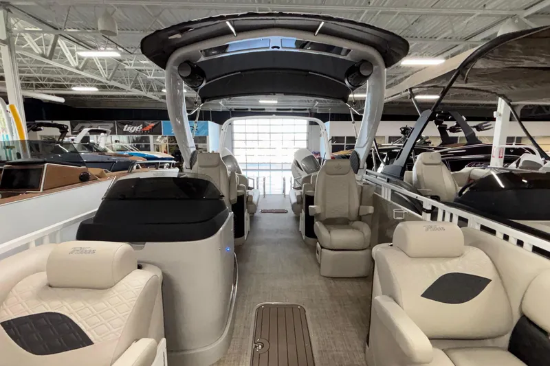 Slide: The Image of 2026 JC Sporttoon 26TT pontoon boat interior with luxurious seating and modern design. - 14