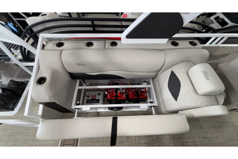 Slide: The Image of Interior view of 2026 JC Sporttoon 26TT boat, featuring luxurious seating and integrated storage. - 26