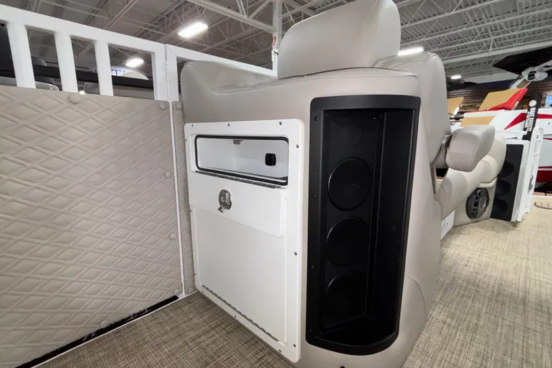 Slide: The Image of Interior of 2026 JC Sporttoon 26TT boat with speaker and storage compartment. - 32