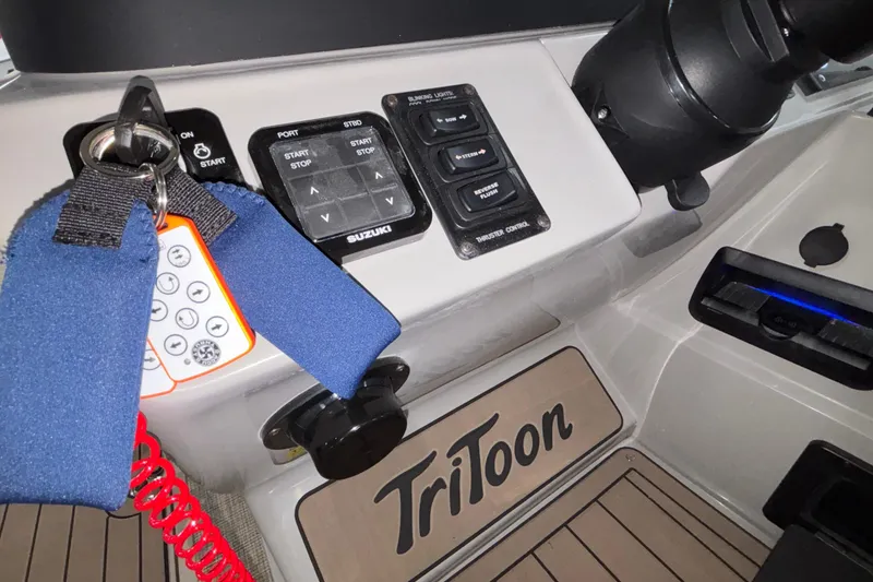 Slide: The Image of Control panel of 2026 JC Sporttoon 26TT boat with keys and switches. - 20