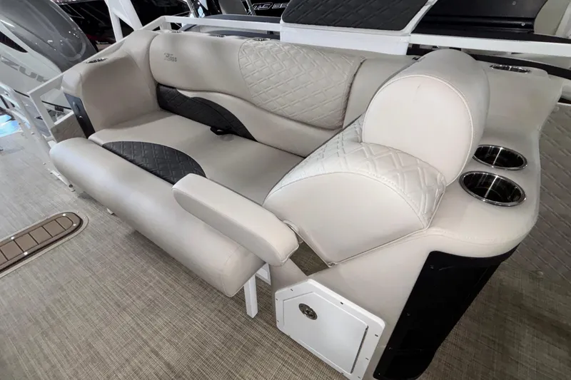 Slide: The Image of Luxurious seating on 2026 JC Sporttoon 26TT boat with quilted upholstery and cup holders. - 22
