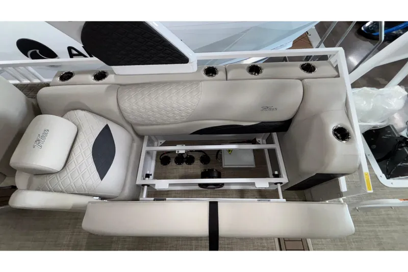 Slide: The Image of Luxurious seating on 2026 JC Sporttoon 26TT boat, featuring cup holders and quilted upholstery. - 25