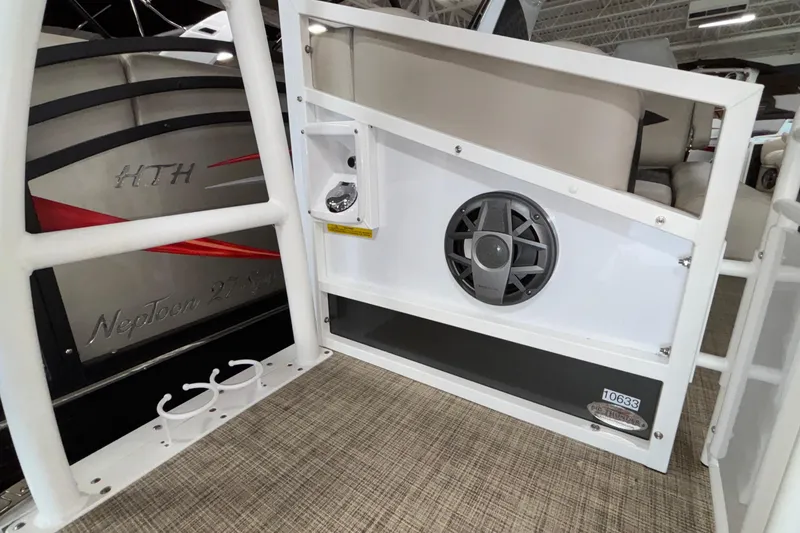 Slide: The Image of 2026 JC Sporttoon 26TT boat interior with speaker and cup holders. - 29