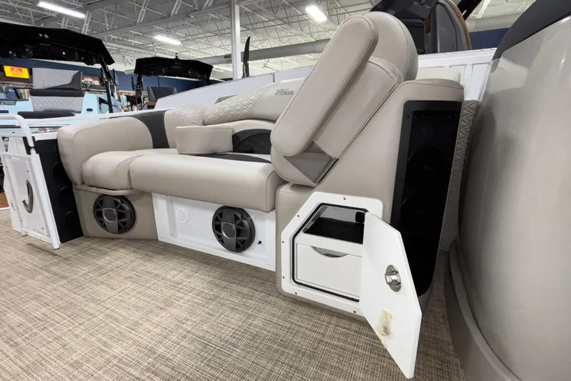 Slide: The Image of Luxurious seating on the 2026 JC Sporttoon 26TT boat with integrated speakers and storage. - 34