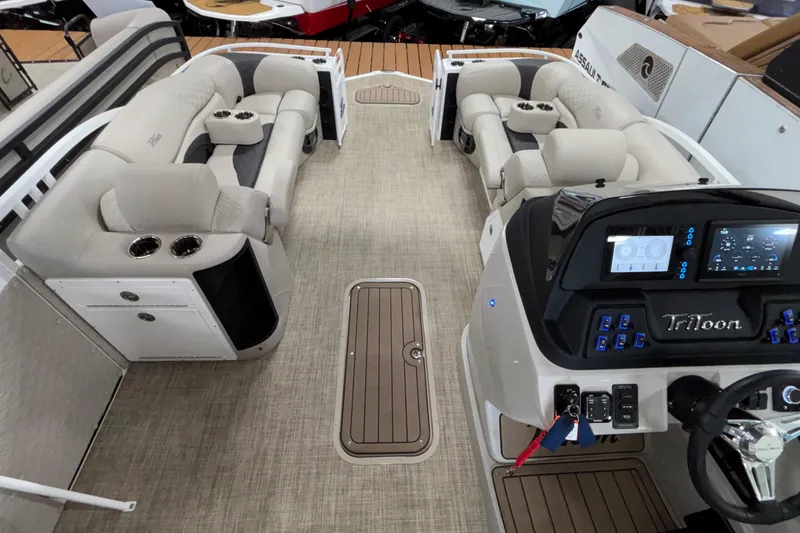 Slide: The Image of Interior of 2026 JC Sporttoon 26TT pontoon boat with plush seating and modern dashboard. - 5