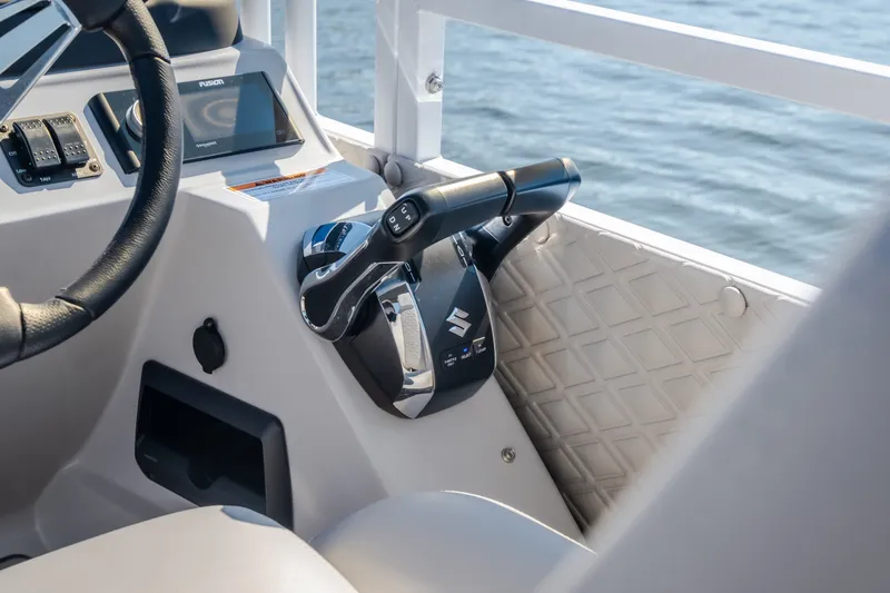 Slide: The Image of Control panel of 2026 JC Sporttoon 26TT boat with steering wheel and throttle lever. - 35