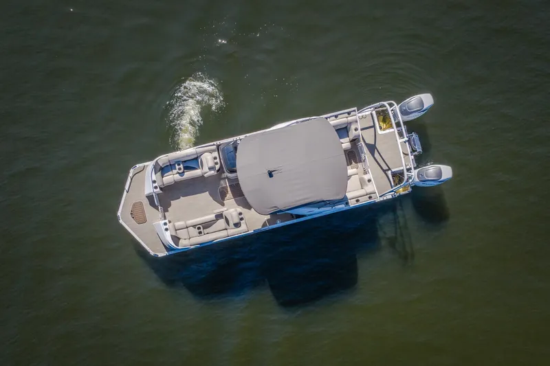Slide: The Image of Aerial view of 2026 JC Sporttoon 26TT pontoon boat cruising on water. - 61