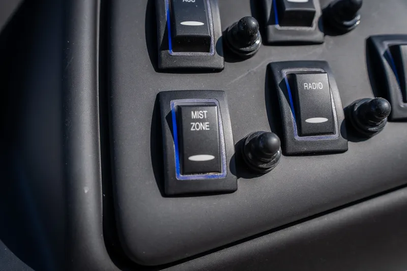 Slide: The Image of Control panel of JC Sporttoon 26TT 2026 with mist zone and radio switches. - 50