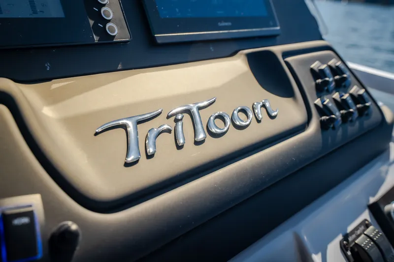Slide: The Image of Dashboard of 2026 JC Sporttoon 26TT boat with TriToon branding. - 51
