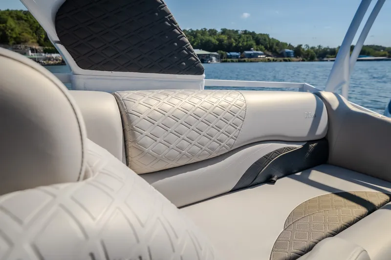 Slide: The Image of Luxurious seating on the 2026 JC Sporttoon 26TT boat, featuring elegant diamond-pattern upholstery. - 44
