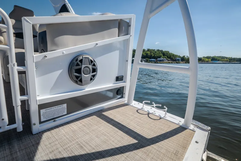 Slide: The Image of 2026 JC Sporttoon 26TT pontoon boat with speaker, on a sunny lake. - 10