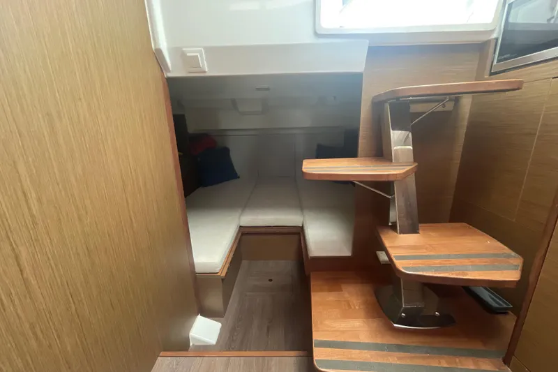 Slide: The Image of Interior cabin of 2019 Jeanneau Leader 10.5 with wooden stairs and cozy seating area. - 17