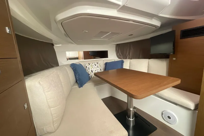 Slide: The Image of Interior of 2019 Jeanneau Leader 10.5 yacht with cozy seating and wooden table. - 20