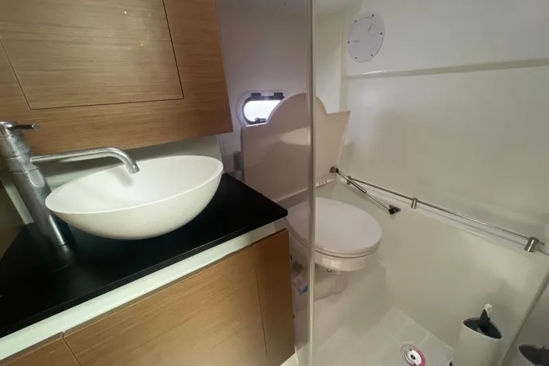 Slide: The Image of Modern bathroom in 2019 Jeanneau Leader 10.5 boat with sleek sink and toilet. - 21