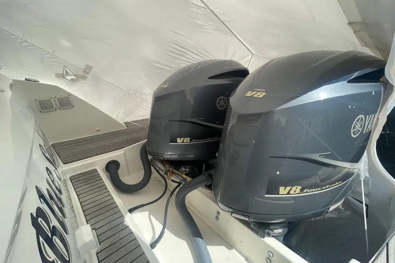 Slide: The Image of 2019 Jeanneau Leader 10.5 with dual Yamaha V8 outboard engines, showcasing powerful performance. - 23