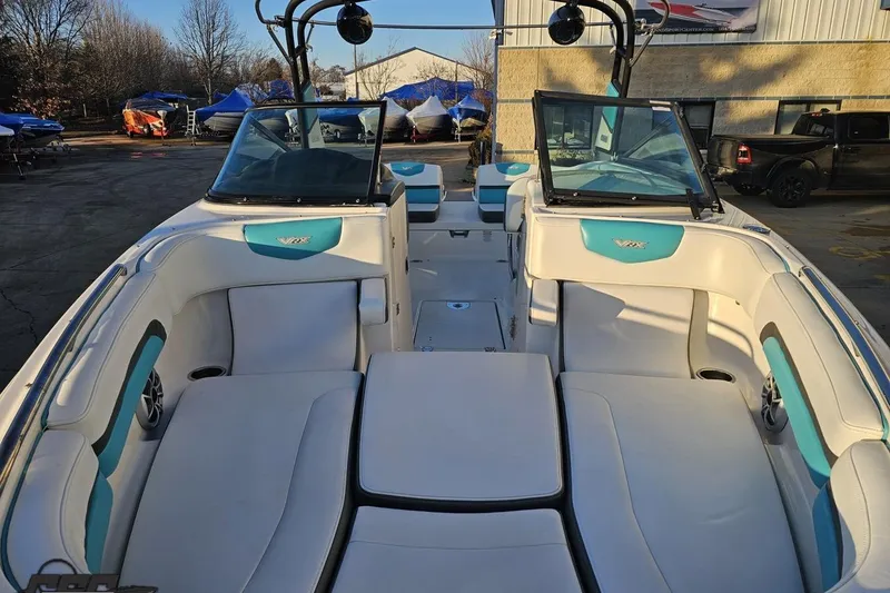 Slide: The Image of 2016 Chaparral Vortex 243 VRX boat interior with white and teal seating. - 13