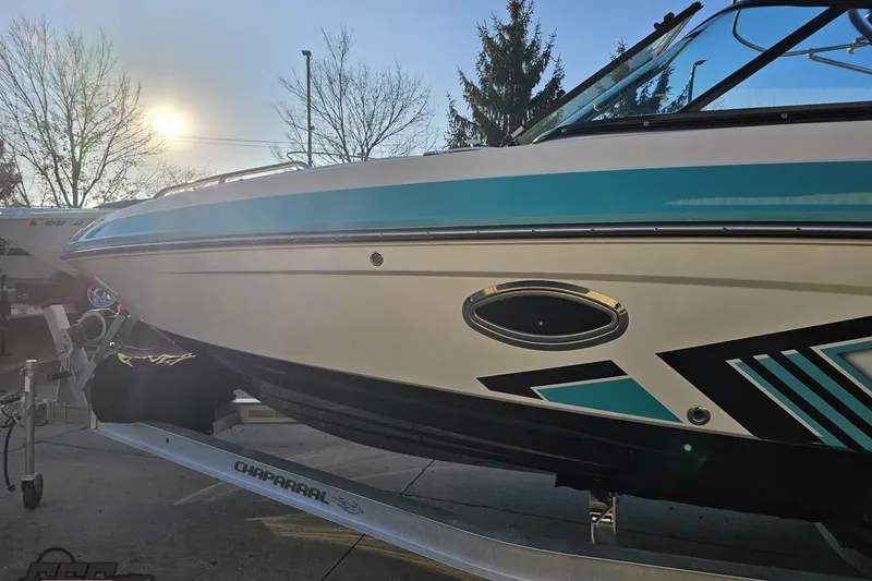 Slide: The Image of 2016 Chaparral Vortex 243 VRX boat on trailer, sunlit background. - 20