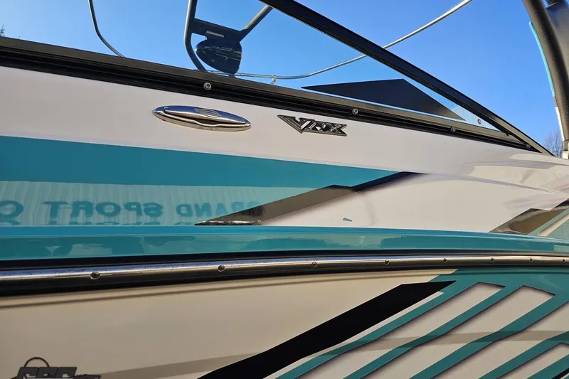 Slide: The Image of 2016 Chaparral Vortex 243 VRX boat with sleek turquoise and white design. - 21