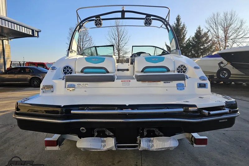 Slide: The Image of 2016 Chaparral Vortex 243 VRX boat, rear view, parked outdoors. - 30