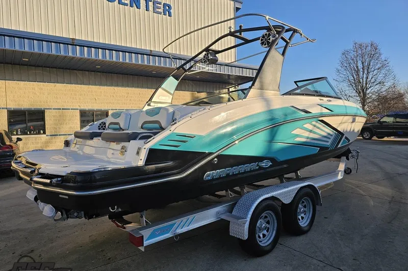 Slide: The Image of 2016 Chaparral Vortex 243 VRX boat on trailer, parked outside a building. - 32
