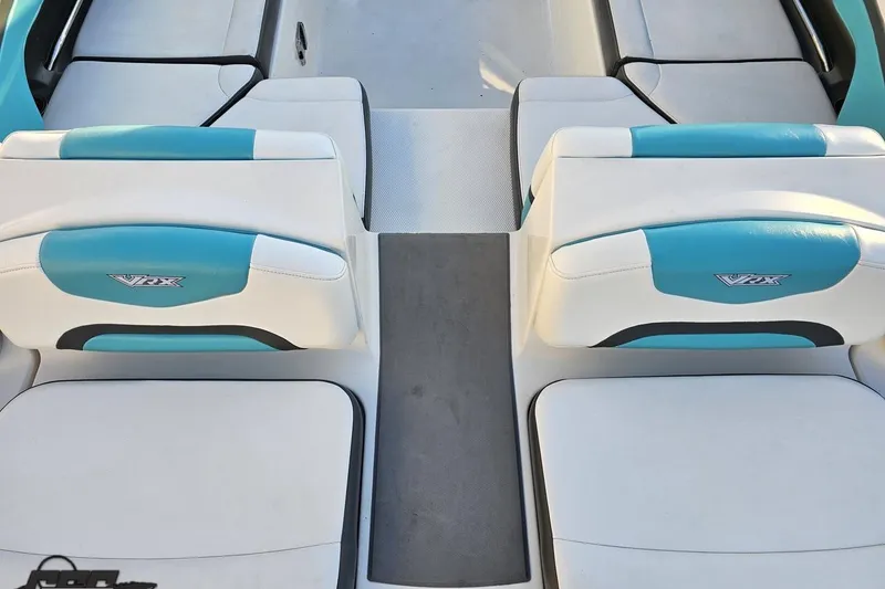 Slide: The Image of 2016 Chaparral Vortex 243 VRX boat interior with blue and white seating. - 34
