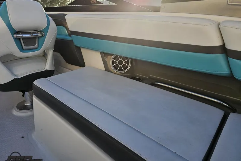 Slide: The Image of 2016 Chaparral Vortex 243 VRX interior with blue and white seating, speaker detail. - 47