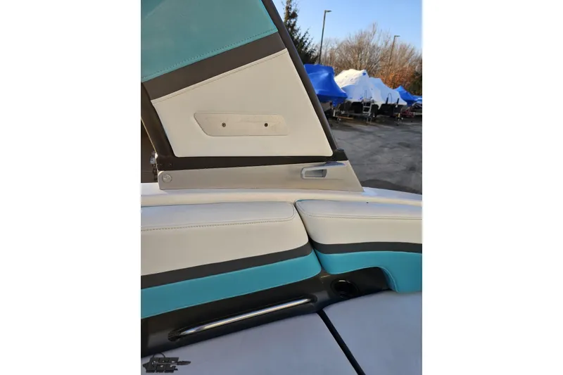 Slide: The Image of 2016 Chaparral Vortex 243 VRX boat interior with blue and white seating. - 48