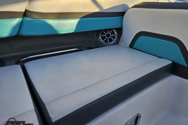 Slide: The Image of 2016 Chaparral Vortex 243 VRX boat interior with teal and white seating. - 49