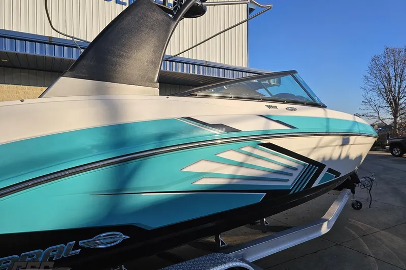 Slide: The Image of 2016 Chaparral Vortex 243 VRX boat with blue and white design on trailer. - 5