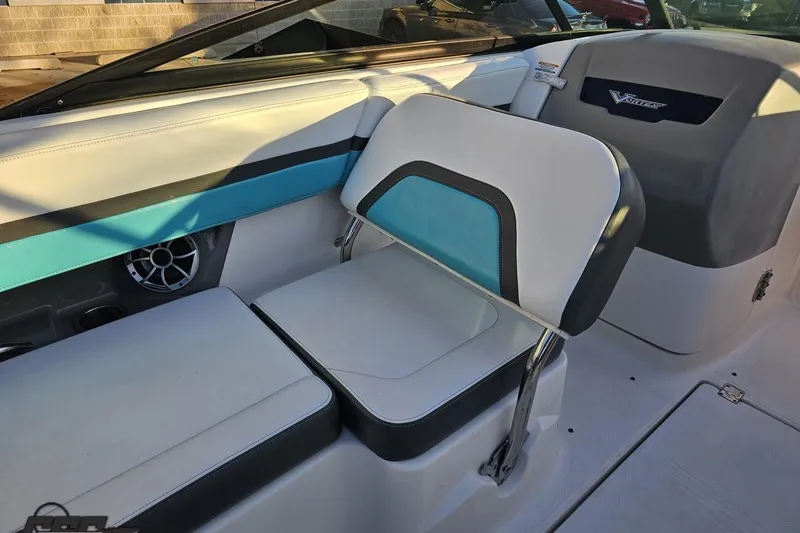 Slide: The Image of Interior seating of 2016 Chaparral Vortex 243 VRX boat, featuring blue and white upholstery. - 50