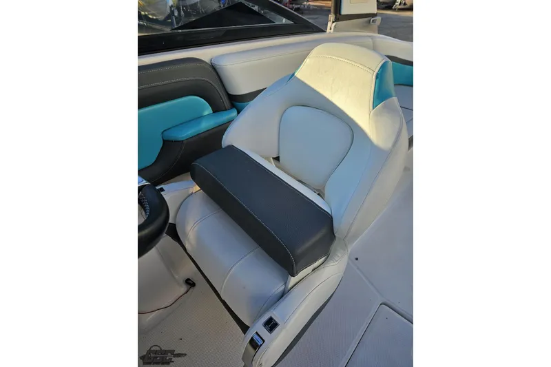 Slide: The Image of 2016 Chaparral Vortex 243 VRX boat seat with white and blue upholstery. - 58