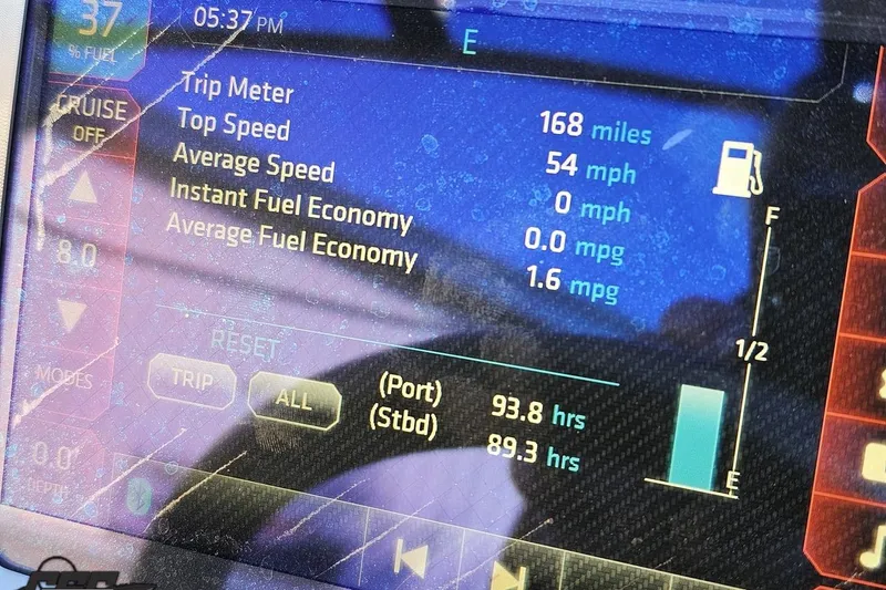 Slide: The Image of Dashboard display of a 2016 Chaparral Vortex 243 VRX showing trip and fuel data. - 64