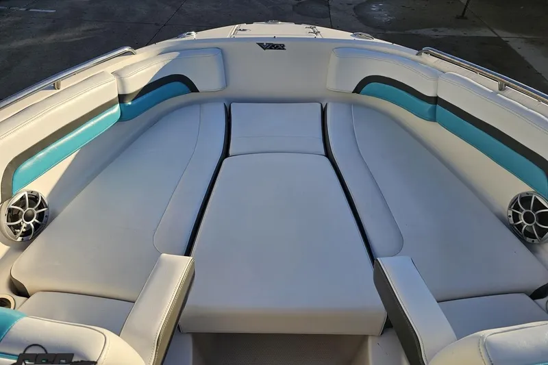 Slide: The Image of 2016 Chaparral Vortex 243 VRX boat interior with white and teal seating. - 67