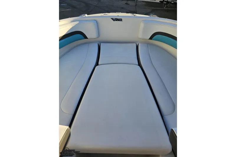 Slide: The Image of 2016 Chaparral Vortex 243 VRX boat interior with white cushioned seating. - 68