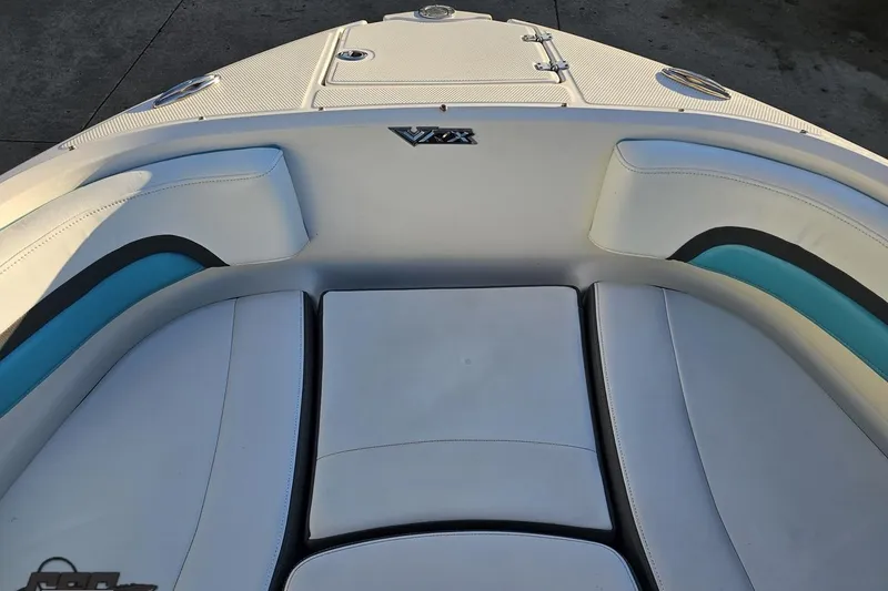 Slide: The Image of 2016 Chaparral Vortex 243 VRX boat interior with white and blue seating. - 69