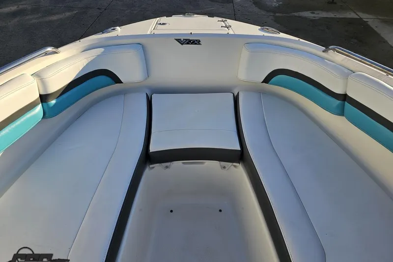 Slide: The Image of 2016 Chaparral Vortex 243 VRX boat interior with white and blue seating. - 71
