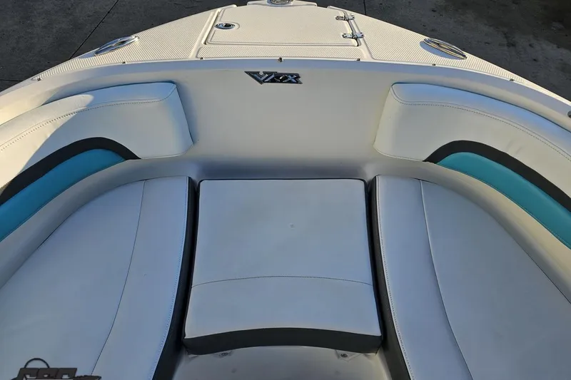 Slide: The Image of 2016 Chaparral Vortex 243 VRX boat interior with white and blue seating. - 72