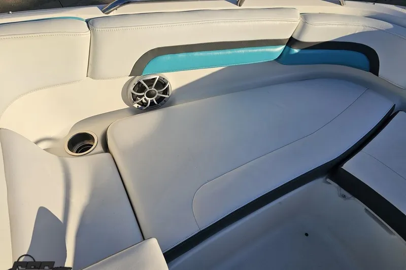 Slide: The Image of 2016 Chaparral Vortex 243 VRX boat interior with cushioned seating and speaker. - 75
