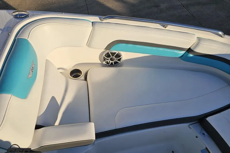 Slide: The Image of 2016 Chaparral Vortex 243 VRX boat interior with white and teal seating. - 76