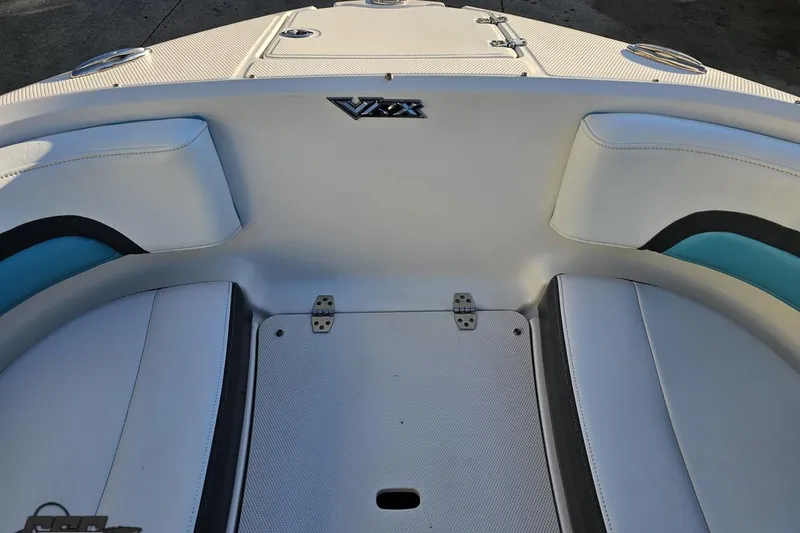 Slide: The Image of 2016 Chaparral Vortex 243 VRX boat interior with white and blue seating. - 77