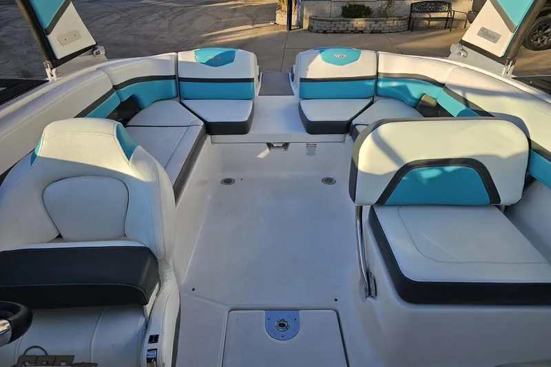 Slide: The Image of 2016 Chaparral Vortex 243 VRX boat interior with white and blue seating. - 82