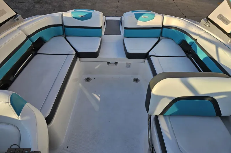 Slide: The Image of 2016 Chaparral Vortex 243 VRX boat interior with spacious seating and modern design. - 83