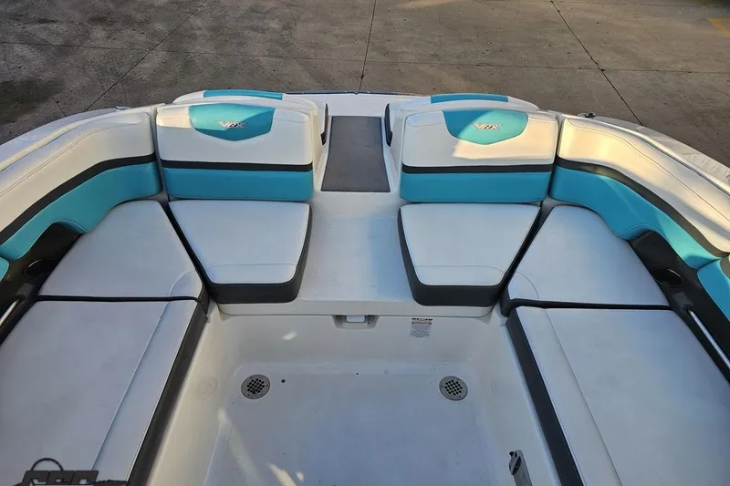 Slide: The Image of 2016 Chaparral Vortex 243 VRX boat interior with blue and white seating. - 84
