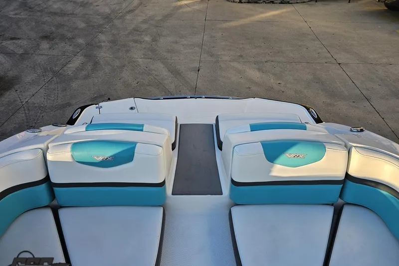 Slide: The Image of 2016 Chaparral Vortex 243 VRX boat interior with blue and white seating. - 85