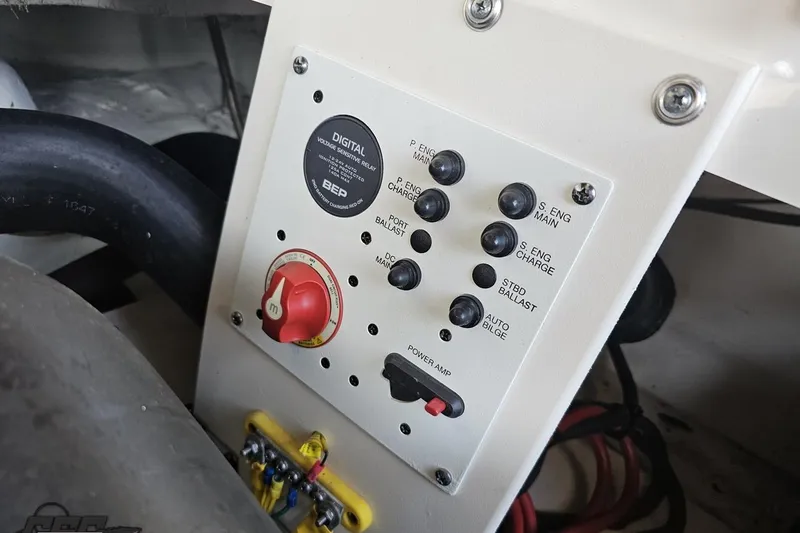 Slide: The Image of Control panel of a 2016 Chaparral Vortex 243 VRX boat with switches and a digital relay. - 92