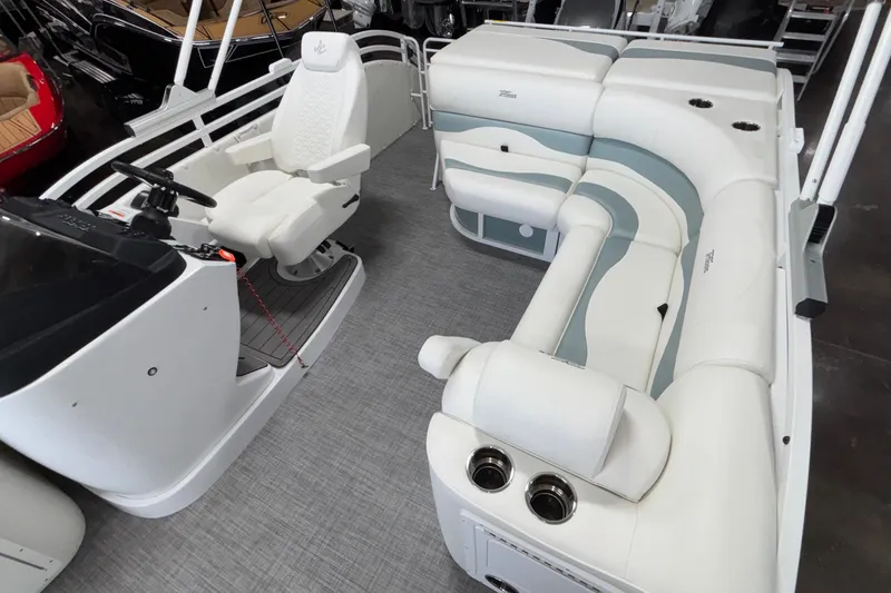 Slide: The Image of 2026 JC Neptoon 25TT Sport pontoon boat interior with white seating and helm. - 19