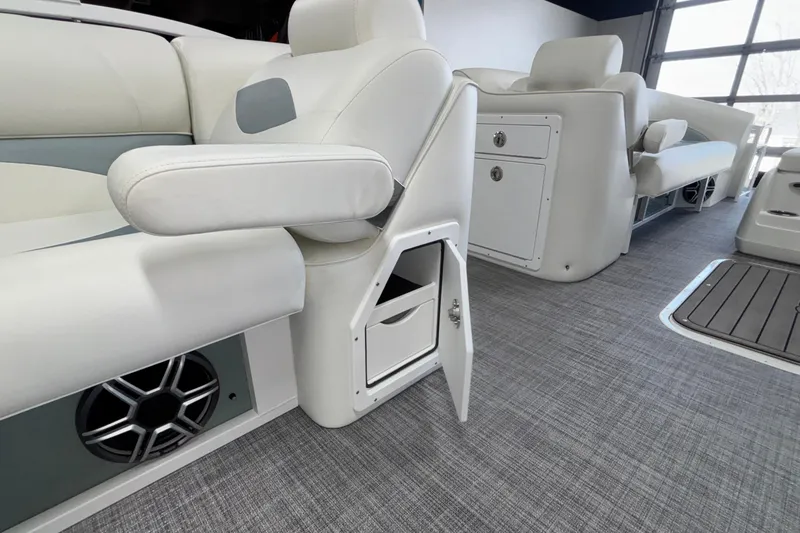 Slide: The Image of 2026 JC Neptoon 25TT Sport interior with open storage compartment and luxurious seating. - 37