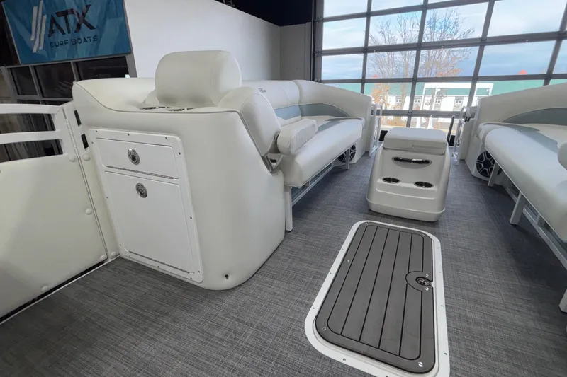 Slide: The Image of Luxurious interior of 2026 JC Neptoon 25TT Sport pontoon boat with plush seating. - 38