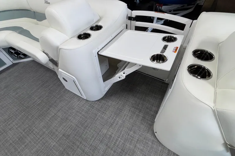 Slide: The Image of 2026 JC Neptoon 25TT Sport boat interior with white seating and built-in cup holders. - 42