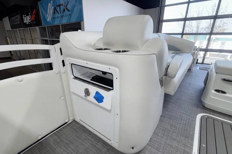 Slide: The Image of Interior of 2026 JC Neptoon 25TT Sport boat with white seating and storage compartment. - 44